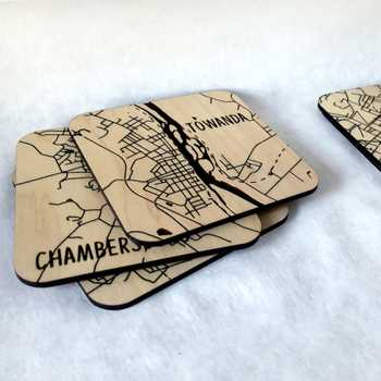 Coasters with local map engravings